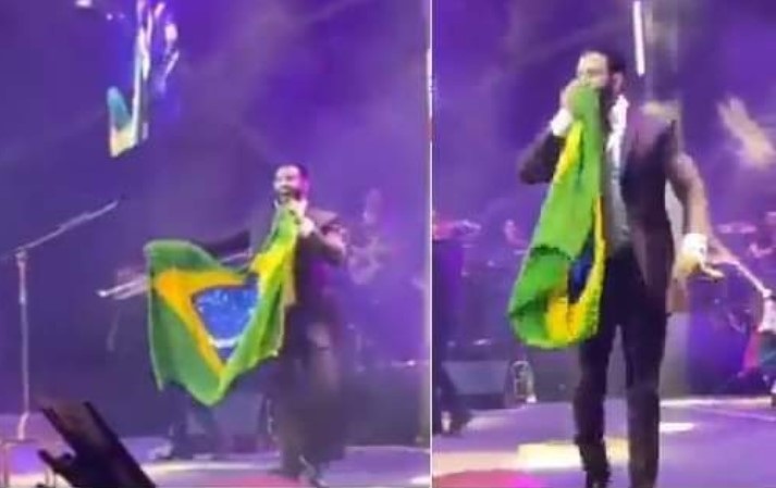 Gusttavo Lima beija bandeira do Brasil em resposta às manifestações do Lollapalooza